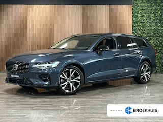 Volvo V60 B4 Plus Dark | Schuifdak | Trekhaak | Adaptieve Cruise Control | Stoelverwarming voor+achter | Stuurwielverwarming | Parkeercamera | Full LED Meesturende koplampen | Pilot Assist | BLIS Dode Hoek Detectie | Elektrische voorstoelen geheugen | Lederen bekleding | Zitting verlenging voorstoelen | 18 Inch | Google Infotainment | Keyless Drive | Parkeersensoren voor+achter | Privacy Glass | Elektrisch bedienbare achterklep | Breedstralers in voorbumper | DAB Radio | Apple Carplay/Android Auto | Volvo On Call met mobiele App functie | Denim Blue Metallic |