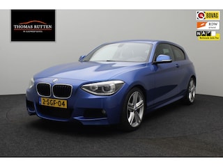 BMW 118i High Executive 2013 | Navigatie | Harman Kardon | Cruise Control | Airco | Stuurwiel Bediening | Stoel Verwarming | DAB Radio | Parkeersensoren | Nationale Autopas
