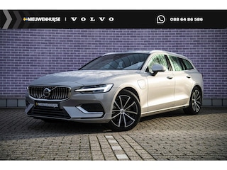 Volvo V60 T6 Plug-in Hybrid AWD Essential Bright | PHEV Long Range | SOH 99% | Trekhaak | Lederen Bekleding | Achteruitrijcamera | Parkeersensoren | Stoelverwarming voor en achter | Cruise Control Adaptief | BLIS | Google Navigatie | Apple Carplay | Android Auto