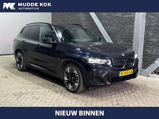 BMW iX3 High Executive 80 kWh | Harman/Kardon | Trekhaak | Head-Up | Parkeerassistent Plus | Adaptief M-onderstel | Stoel+Stuurverwarming | 20 Inch