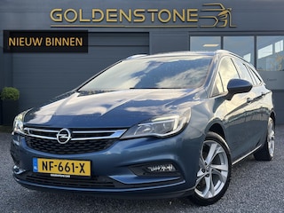 Opel Astra Sports Tourer 1.0 Innovation ✓1e Eigenaar✓Camera✓Trekhaak✓Carplay✓Navi✓Halfleder✓105pk✓Pdc V+A✓Recent beurt gehad✓Clima✓Cruise✓Rijstrooksensor✓N.A.P✓Apk tot 10-2027