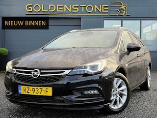 Opel Astra Sports Tourer 1.4 Innovation ✓Trekhaak✓Camera✓Carplay✓Navi✓Recent beurt gehad✓150pk✓Keyless✓Halfleder✓6 Bak✓Rijstrooksensor✓Dodehoeksensor✓Pdc V+A✓Lm velgen✓Clima✓Cruise✓N.A.P✓Apk tot 09-2027