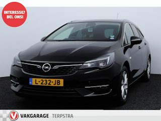 Opel Astra Sports Tourer 1.2 Elegance/ Trekhaak/ 16'' LMV/ LED Koplampen!/ Stoel + Stuurverw./ Camera/ Apple + Android/ Half-Leder/ Dode-Hoek DET./ Extra getint glas/ PDC V+A/ Navi/ Clima/ Cruise/ Bluetooth.