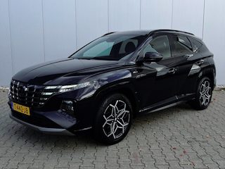 Hyundai Tucson 1.6 T-GDI HEV Premium Sky | Trekhaak | All-season banden | Elektrisch glazen panorama-dak | Cruise Control Adaptief | Apple Carplay/Android Auto | Stoel en stuurverwarming |
