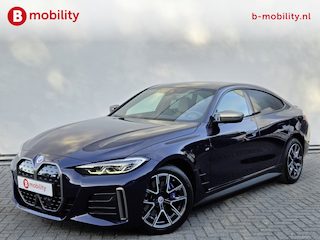 BMW i4 M50 High Executive M-Sport 84 kWh 'Tansanitblau' SOH 96% NL Auto! | 360 Camera | Hifi | DAB | Snelladen | Leer | Head-Up