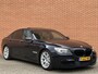 BMW 7-Serie 740d High Executive M-pakket | Head-Up Display | Softclose | Adaptieve cruise control | 19" Lichtmetaal  | Camera | Leder | Navigatie | Elektrisch Stuurwiel | Stuurwielverwarming