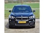BMW X1 18d sDrive High Executive / head-up display / panoramadak / camera achter / zwart leer