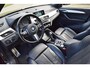 BMW X1 18d sDrive High Executive / head-up display / panoramadak / camera achter / zwart leer
