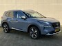 Nissan X-Trail 1.5 e-4orce Tekna 4WD 7p. / Full Options / 7 Persoons! / Trekhaak 1.650 KG Trekgewicht / Lederen bekleding / 3-Zone Climate Control / Parkeersensoren Voor + Achter / Adaptieve Cruise Control / Navigatie / Stoel- & Stuurverwarming / Groot Scherm / Elektrische Achterklep / Elektrische Stoelen /