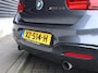 BMW 1-Serie M140i Centennial Executive | Handbak | Clima | Cruise | Navi | Alcantara | M-Sport | PDC | LED | Multimedia |