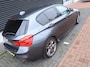 BMW 1-Serie M140i Centennial Executive | Handbak | Clima | Cruise | Navi | Alcantara | M-Sport | PDC | LED | Multimedia |