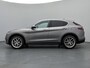 Alfa Romeo Stelvio First Edition 280 pk Automaat | Navigatie | Achteruitrijcamera | Lederen Bekleding | Voorstoelen Verwarmd | Bi-Xenon Koplampen | Keyless Entry/Start | Dodehoek Detectie | Premium Audio | 20" Lichtmetalen Velgen | Apple Carplay/Android Auto |