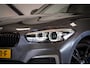 BMW 1-Serie M140i Edition Shadow High Executive | Schuifdak | H/K | Navi Prof. | Memory Seat | H/K | NL-Auto | Adapt. Onderst. |