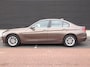 BMW 3-Serie 320i Executive | Clima | Cruise | Navi | PDC+Camera | Xenon | Multimedia | Start/Stop |