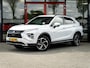 Mitsubishi Eclipse Cross 2.4 PHEV First Edition 4WD | Trekhaak | Navigatie | Stoelverwarming | Stuurwiel Verwarmd | HUD | DAB+ | Camera | Adaptieve Cruise Control | Parelmoer Lak | Origineel NL | 2e Eigenaar |