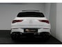 Mercedes-Benz CLA Shooting Brake 220 AMG Line / CLA45 AMG Diffuser / Panamericana Grill / Panoramadak / Burmester Surround Sound / Stoelverwarming / LED High Performance koplampen / Nightpakket / Agility Control / Trekhaak (zwenkbaar) / Ambienteverlichting / Widescreen / 19'' LMV / Elektr. bedienbare achterklep / Dodehoekdetectie / Adaptive Cruise Control / Navigatie