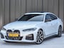 BMW i4 eDrive40 High EXECUTIVE 84 kWh | M-SPORT | SCHUIFDAK | SHADOW-LINE | NL- AUTO | CAMERA | HEAD-UP | TREKHAAK | MEMORY SEATS | AMBIANCE INTERIEUR |