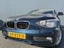 BMW 1-Serie BWJ 2012 116i 136 PK Business 84000KM!! TREKHAAK AFN. / AIRCO / NAVI / CRUISE / BLUETOOTH / PDC ACHTER / MULTIFUNCT. STUUR / LMV 16 INCH / ISOFIX