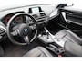 BMW 1-Serie 118i High Executive * Trekhaak * Panoramadak Leder Stoelverwarming