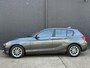 BMW 1-Serie 118i Corporate Lease Executive NAVI | PDC | AIRCO | CRUISE | NWE APK