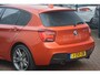BMW 1-Serie M135i RWD High Executive | Navigatie (Prof) | Leer | Keyless | Dealer onderhouden | Hifi audio | Xenon!! | Uniek!! Top uitgevoerde M135i in Valencia Orange. Destijds geleverd door Hofmeister in Zwaag!!