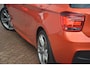 BMW 1-Serie M135i RWD High Executive | Navigatie (Prof) | Leer | Keyless | Dealer onderhouden | Hifi audio | Xenon!! | Uniek!! Top uitgevoerde M135i in Valencia Orange. Destijds geleverd door Hofmeister in Zwaag!!
