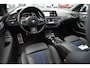 BMW 1-Serie M135i xDrive High Executive 306 PK Dealer o.h. Adaptive Head Up Camera Keyless 18''