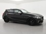 BMW 1-Serie M140i 340 PK M-SPORT AUT8 + HARMAN/KARDON | 19 INCH | SPORTUITLAAT | CAMERA | STOELVERWARMING