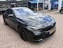 BMW 8-serie Gran Coupé M8 Competition, all black.