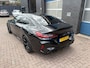 BMW 8-serie Gran Coupé M8 Competition, all black.