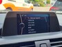 BMW 1-Serie 114i EDE | Met o.a. navigatie, cruise control, armsteun, airco en in goede staat!