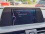 BMW 1-Serie 114i EDE | Met o.a. navigatie, cruise control, armsteun, airco en in goede staat!
