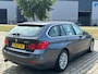 BMW 3-Serie Touring 320i High Executive 2e eigenaar dealer onderhouden navigatie leerbekeleding stoelverwarming cruis control