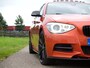 BMW 1-Serie M135i xDrive High Executive ZEER UNIEKE AUTO | Schuifdak | Carbon afwerking | M-performance uitgevoerd | Mosselman stage 1 tuning | Bomvol opties |