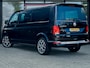 Volkswagen Transporter 2.0 TDI L2H1 30 DC Caravelle Highline | Trekhaak | 6 Zits | Navigatie | Camera | 19'' Lichtmetalen Velgen | Cruise Control | Stoelverwarming | Climate Control | Metallic Lak | All Season Banden | PDC | Dealer Onderhouden |