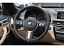 BMW X1 sDrive18i Centennial High Exe. / Panoramadak / Head-up / Leder / 18'' / Keyless / Navigatie / Sportstoelen / Stoelverwarming / Cruise Control