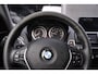 BMW 1-Serie 114i EDE Business+ Navi Leder 18 Inch Cruise kleppen uitlaat PDC achter stoelverwarming voor private-glas