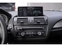 BMW 1-Serie 114i EDE Business+ Navi Leder 18 Inch Cruise kleppen uitlaat PDC achter stoelverwarming voor private-glas