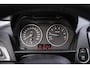 BMW 1-Serie 114i EDE Business+ Navi Leder 18 Inch Cruise kleppen uitlaat PDC achter stoelverwarming voor private-glas