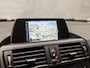BMW 1-Serie 116i Luxury Automaat (4 CILINDER, LOGISCH NAP, NAVIGATIE, DEALER ONDERHOUDEN, XENON, LEDEREN SPORTSTOELEN, CRUISE, PARKEERSENSOREN, NIEUWSTAAT)