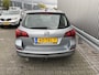 Opel Astra Sports Tourer 1.4 Turbo Cosmo 126Dkm.NAP, AUTOMAAT, Leer/Stof, Navi, CC, PDC, LM, Afn.Trekh, nw. APK – Inruil Mogelijk –