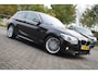 BMW 1-Serie 116i High Executive M-Sport Clima/Cruise/Stoelverwarming/Xenon/PDC/LederSportstoelen/Navi/Bluetooth/RadioAUX.USB/17"LM