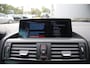 BMW 1-Serie 116i High Executive M-Sport Clima/Cruise/Stoelverwarming/Xenon/PDC/LederSportstoelen/Navi/Bluetooth/RadioAUX.USB/17"LM