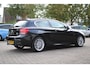 BMW 1-Serie 116i High Executive M-Sport Clima/Cruise/Stoelverwarming/Xenon/PDC/LederSportstoelen/Navi/Bluetooth/RadioAUX.USB/17"LM