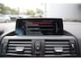 BMW 1-Serie 116i High Executive M-Sport Clima/Cruise/Stoelverwarming/Xenon/PDC/LederSportstoelen/Navi/Bluetooth/RadioAUX.USB/17"LM