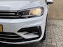 Volkswagen Touran 1.2 TSI 110pk Highline Business R-line 7-persoons | Trekhaak | Navigatie | Camera | Elektrische achterklep | Apple CarPlay | Climate control | Adaptieve cruise | Stoelverwarming | Volledig onderhouden