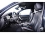 BMW 1-Serie M140i xDrive High Executive Harman Kardon - Elektrisch verwarmde voorstoelen - Sportstoelen - Cruise Control - Achteruitrijcamera - PDC Voor/Achter - Middenarmsteun voor - Adaptieve LED koplampen -