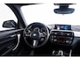 BMW 1-Serie M140i xDrive High Executive Harman Kardon - Elektrisch verwarmde voorstoelen - Sportstoelen - Cruise Control - Achteruitrijcamera - PDC Voor/Achter - Middenarmsteun voor - Adaptieve LED koplampen -