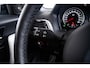 BMW 1-Serie M140i xDrive High Executive Harman Kardon - Elektrisch verwarmde voorstoelen - Sportstoelen - Cruise Control - Achteruitrijcamera - PDC Voor/Achter - Middenarmsteun voor - Adaptieve LED koplampen -