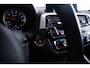 BMW 1-Serie M140i xDrive High Executive Harman Kardon - Elektrisch verwarmde voorstoelen - Sportstoelen - Cruise Control - Achteruitrijcamera - PDC Voor/Achter - Middenarmsteun voor - Adaptieve LED koplampen -